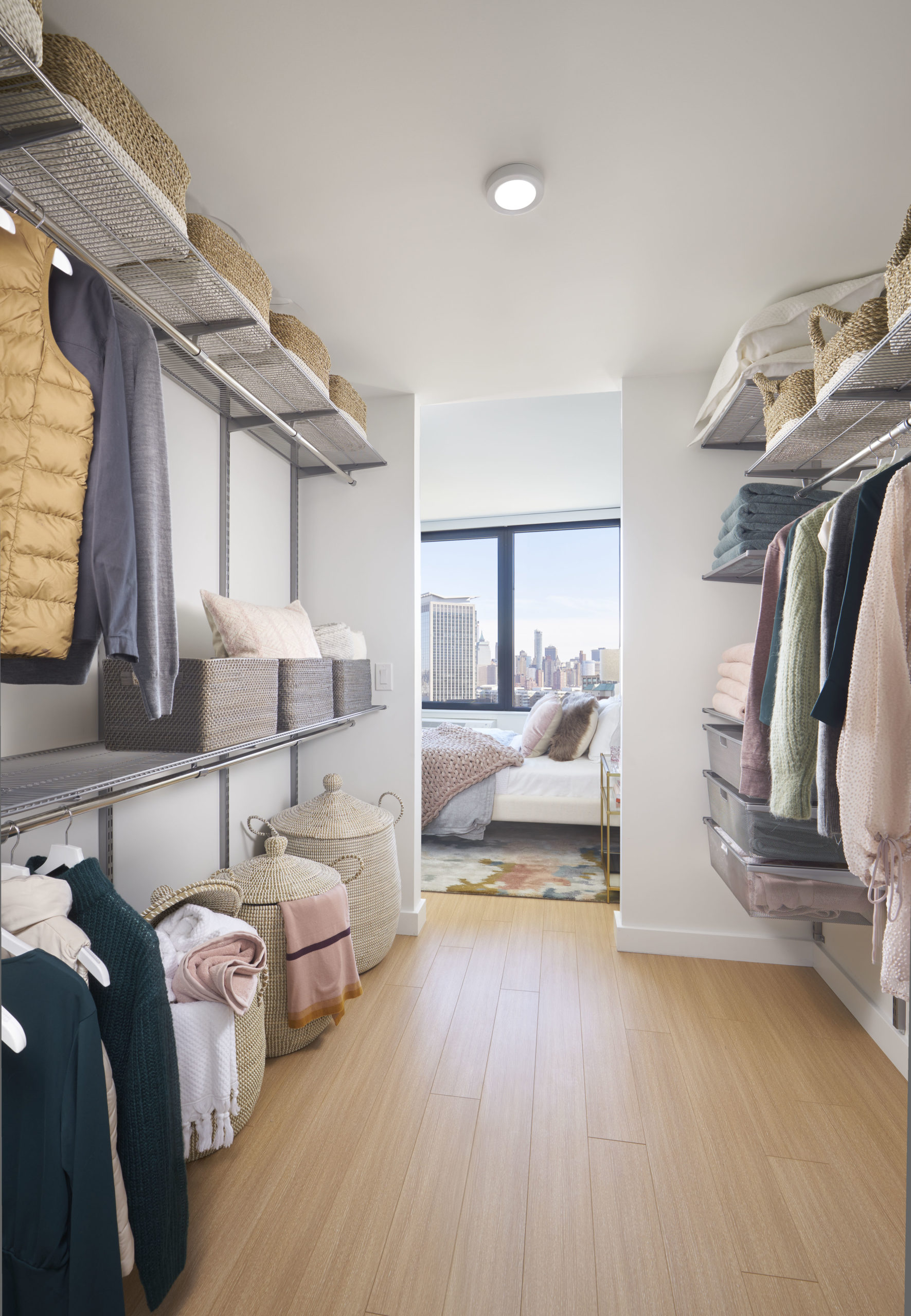 big closets with wardrobe on both sides in bedroom