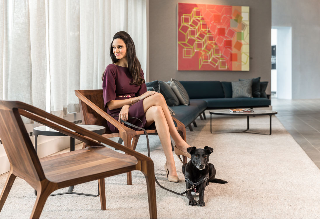Woman-dog-sitting-chairs-resize woman sitting with dog on leash at vyv lobby