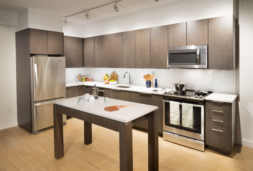 open kitchen with island and wood cabinets