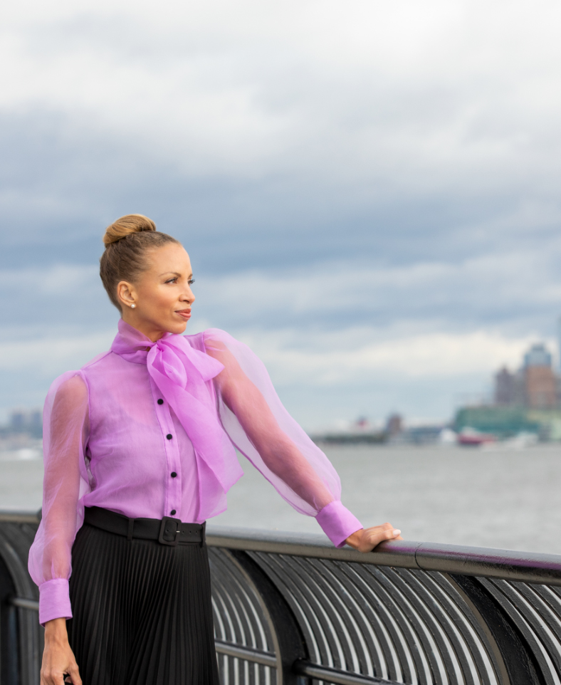 woman at jersey city waterfront overlooking nyc